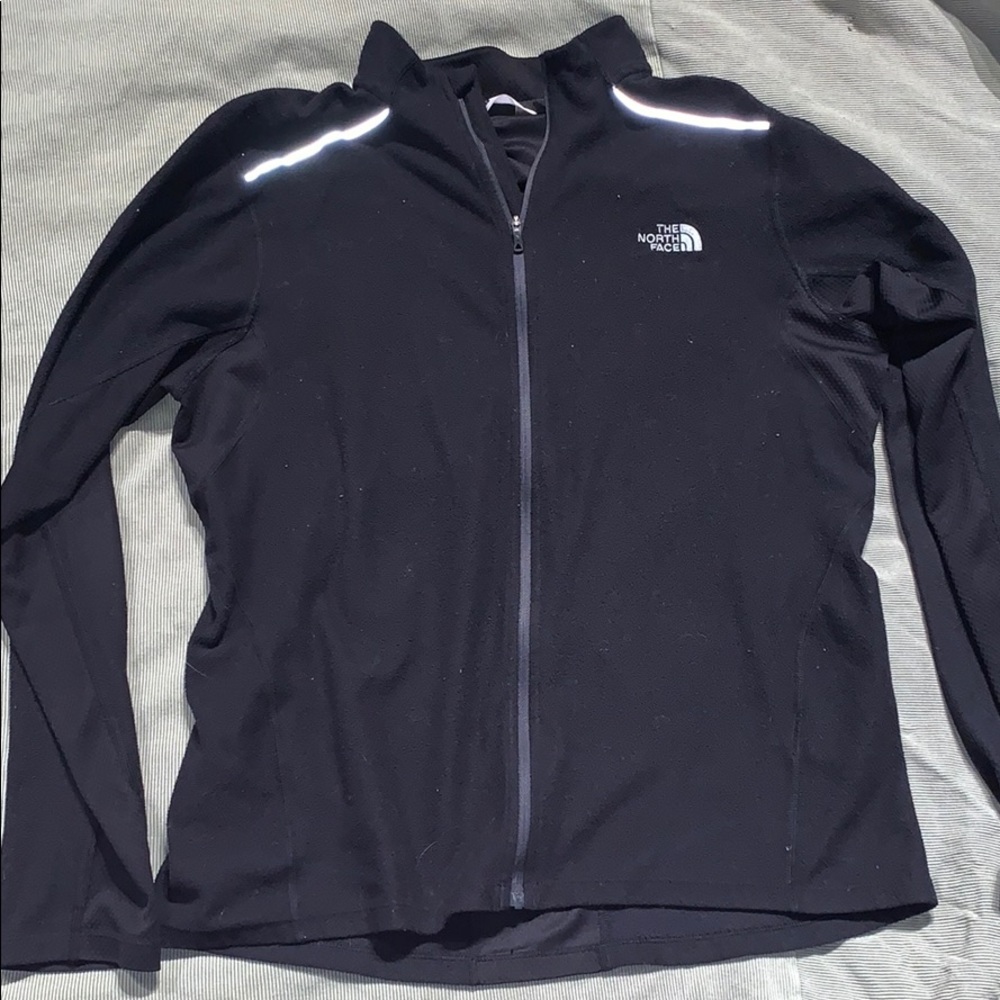Black zip up north face jacket